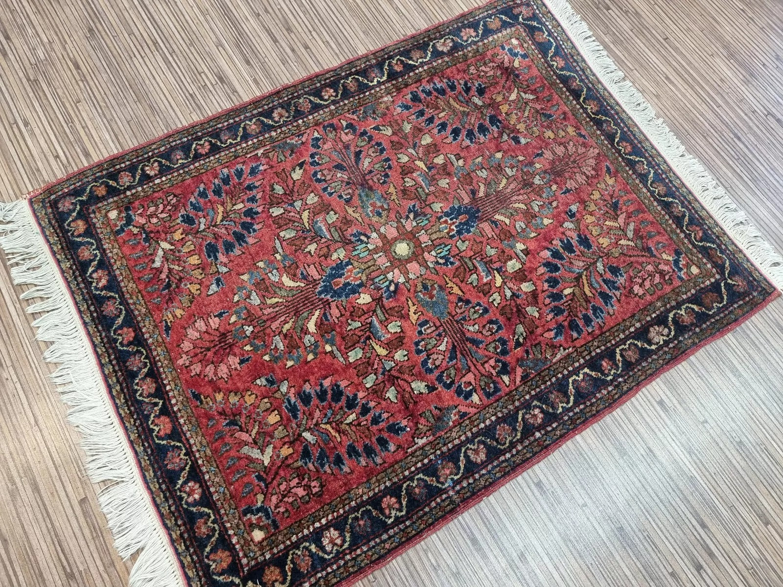Handwoven Persian rug displayed in a vintage-inspired living room setting
