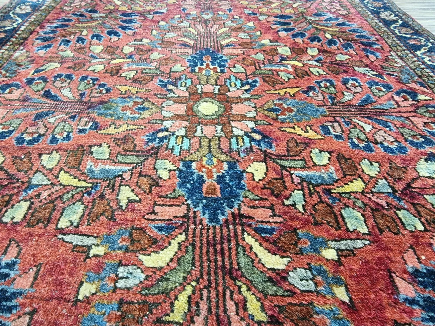 Close-up of hand-knotted wool pile on a cotton foundation from a 1920s Persian rug
