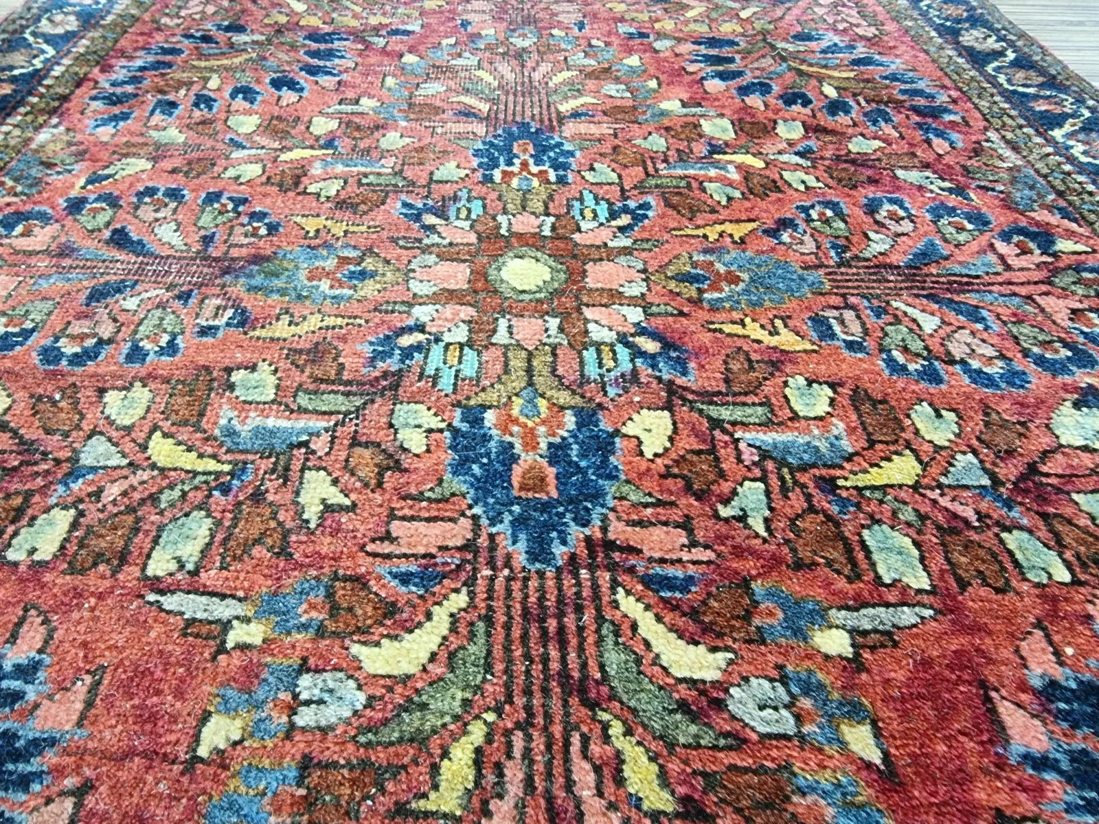 Close-up of hand-knotted wool pile on a cotton foundation from a 1920s Persian rug
