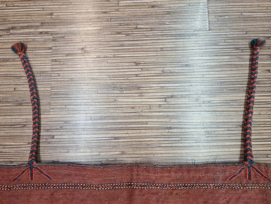 Close-up of intricate geometric motifs on a vintage Turkmen wool textile