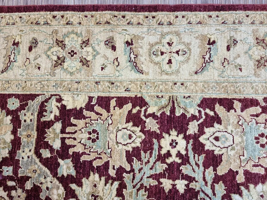 Floral wool rug with light rust border

