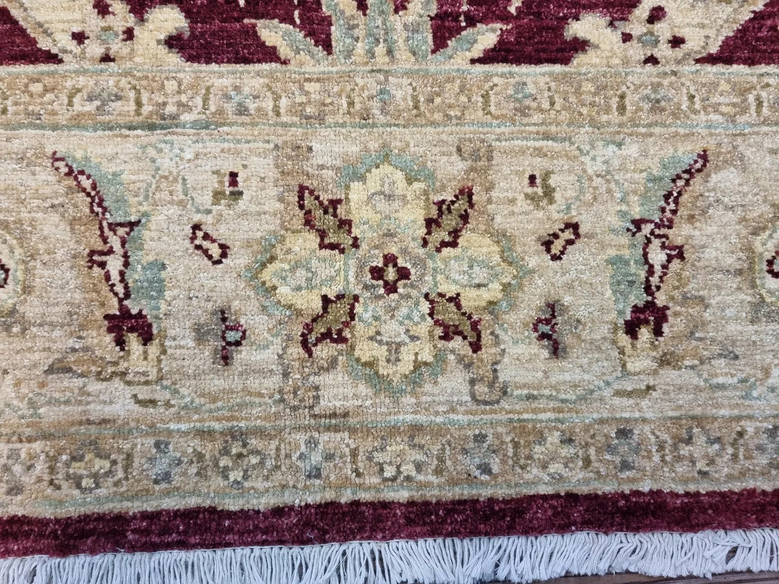 1980s Afghan rug with scrolling floral design

