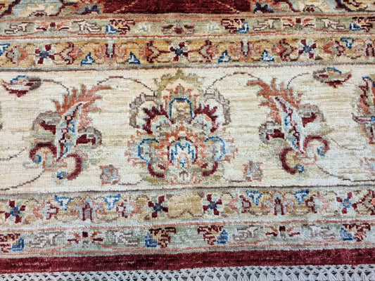 Handmade floral-pattern Afghan carpet 6.6 x 9.8 feet

