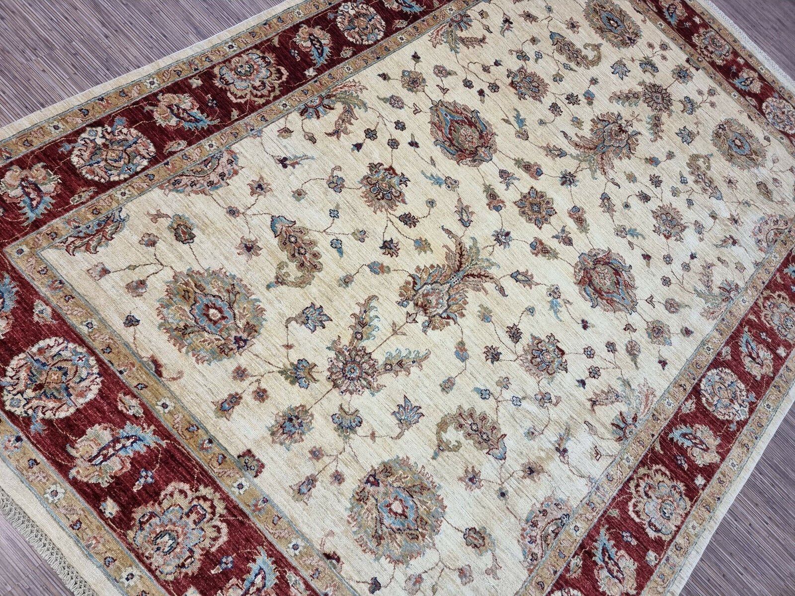 Large Zigler rug in warm red and beige tones

