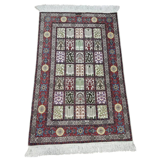 Vintage Persian Qum silk rug with floral medallion

