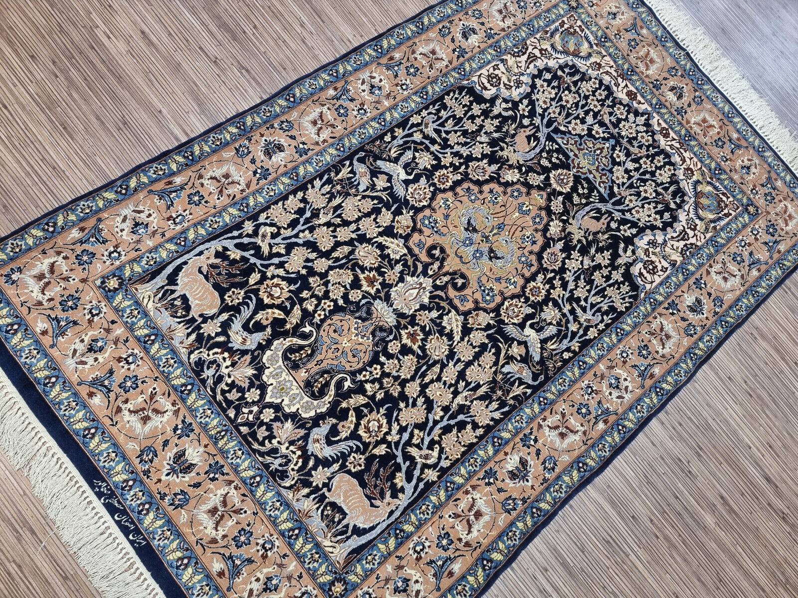 Shot focusing on the rich blue color palette and delicate arabesque motifs.

