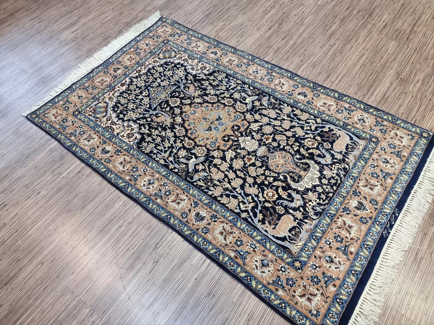 Close-up on the light wear on the rug's fringe, demonstrating its condition.

