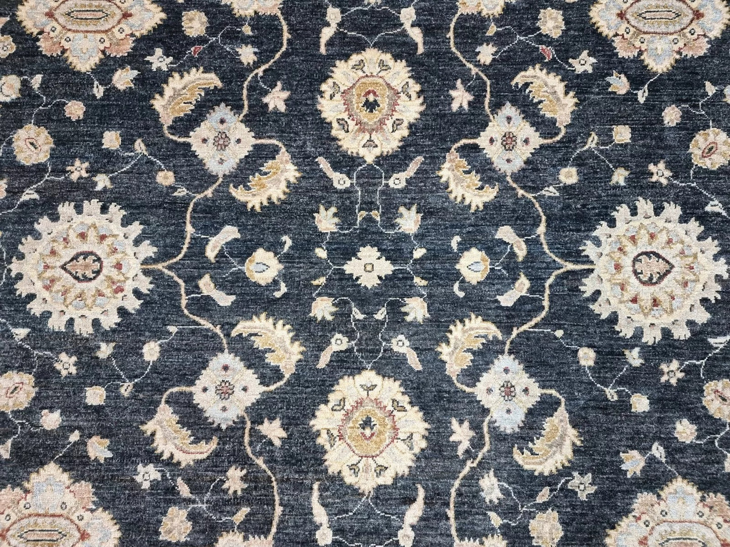 Close-up of the precise hand-knotting on the rug's surface.

