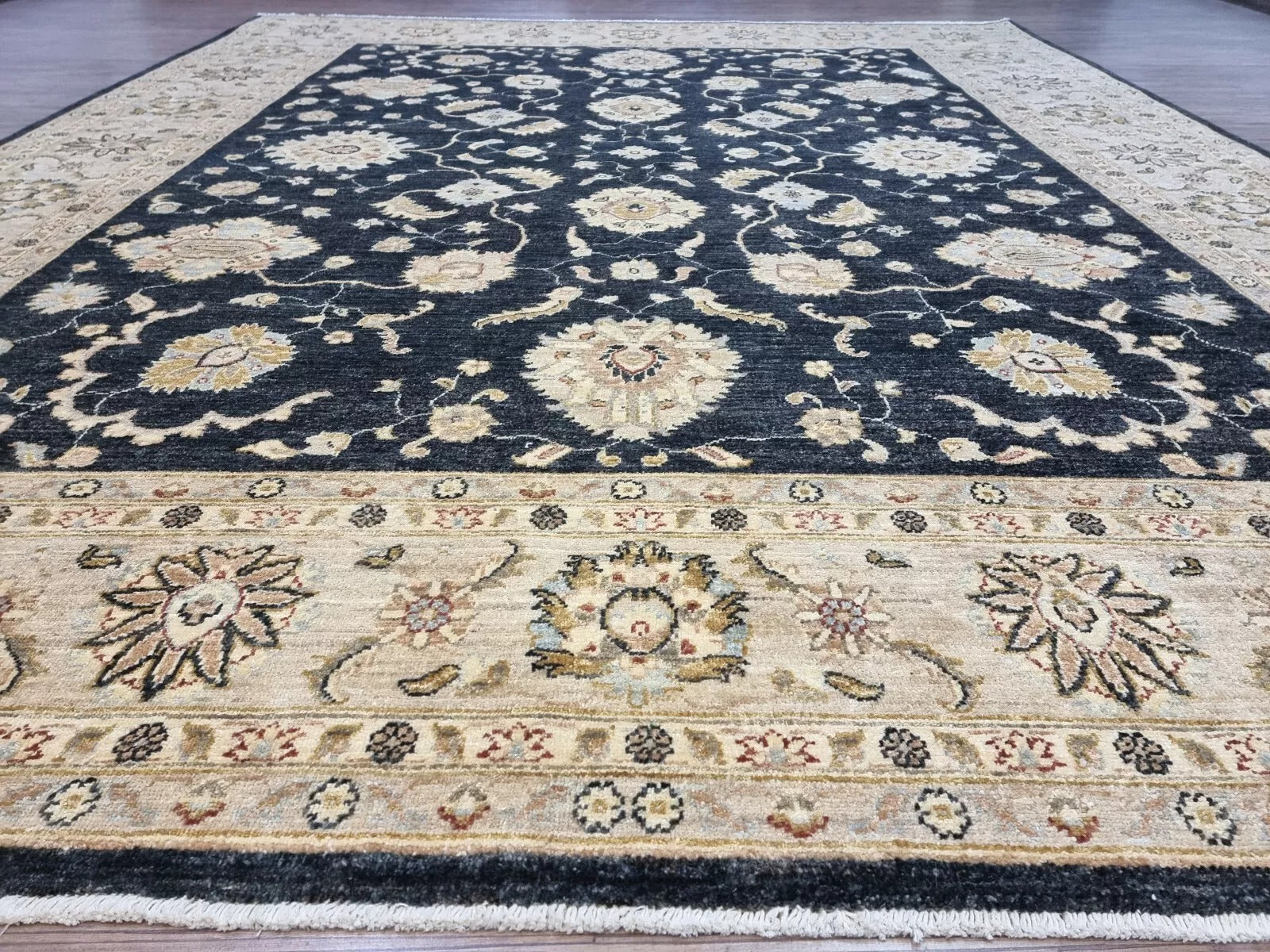Angle shot capturing the scale and dramatic presence of the oversized rug.


