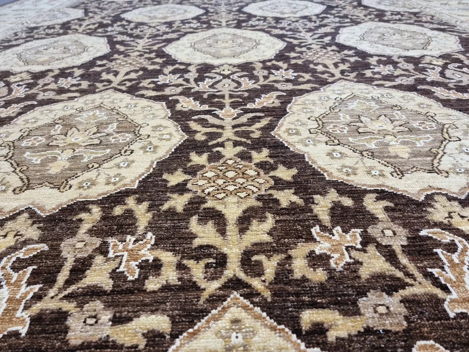 A section of the rug showcasing the rhythmic repetition of the elegant motifs.

