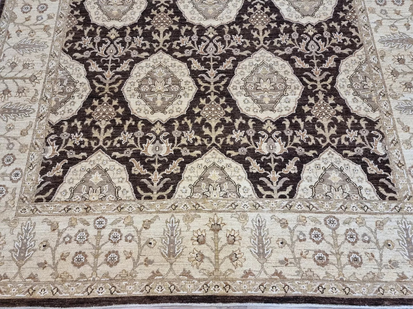 Detail of the warm, neutral background color and the wool's textured surface.

