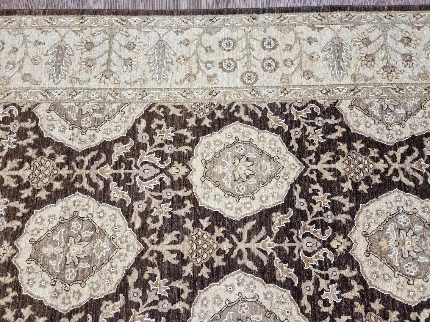 Close-up of the precise hand-knotting and the rug's dense pile.

