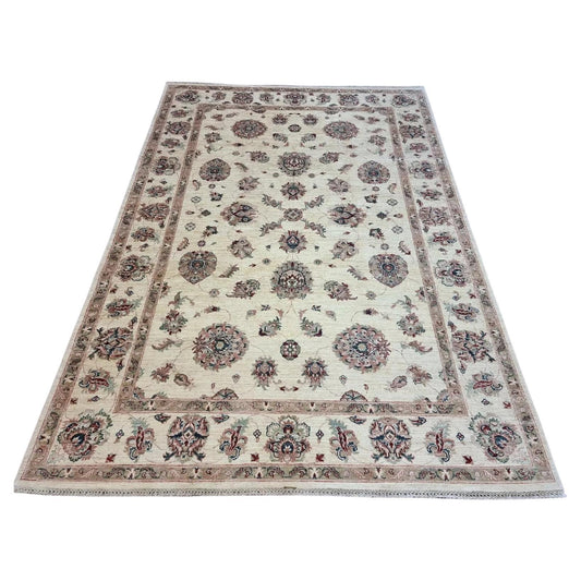 Full top view of the vintage Afghan Zigler rug showing the complete all-over floral pattern in beige.

