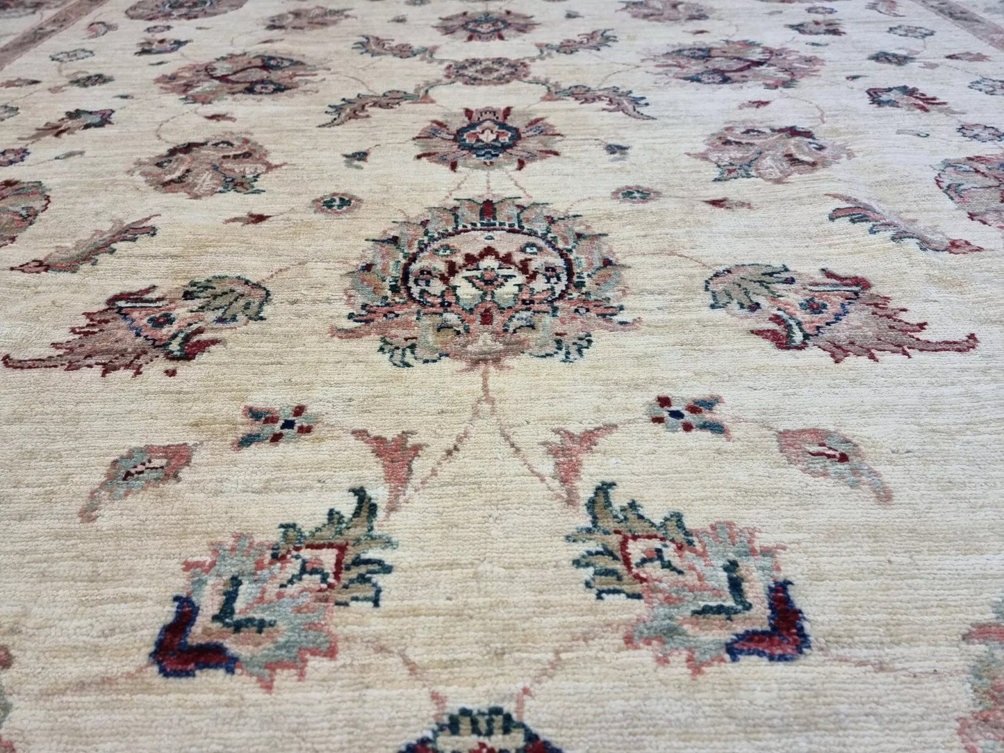 A section of the rug showcasing the rhythmic repetition of the elegant motifs.


