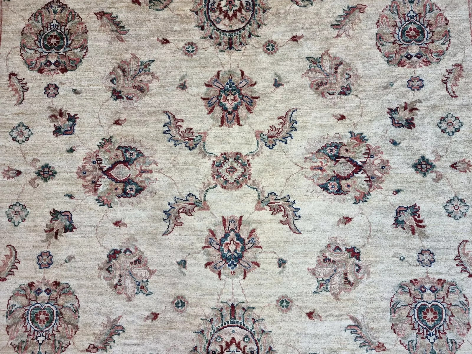 Close-up of the precise hand-knotting and the rug's dense, even pile.

