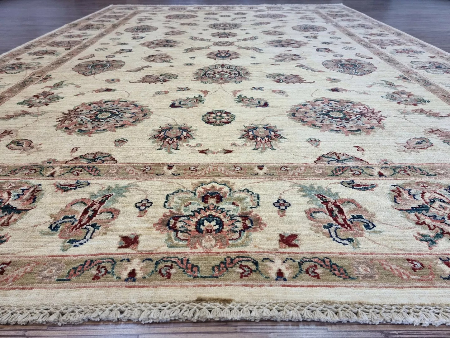 Angle shot capturing the elegant scale and neutral presence of the rug.


