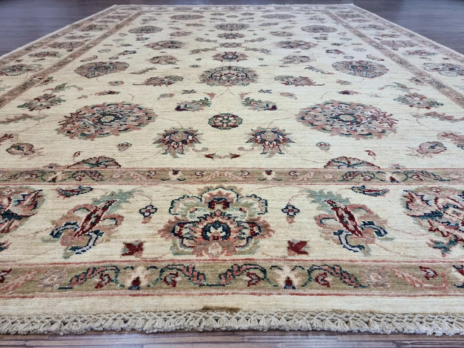 Angle shot capturing the elegant scale and neutral presence of the rug.

