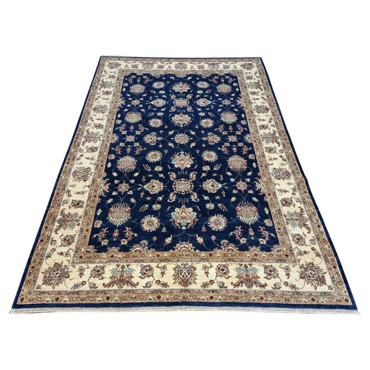 Full top view of the vintage Afghan Zigler rug showing the complete blue all-over floral pattern.

