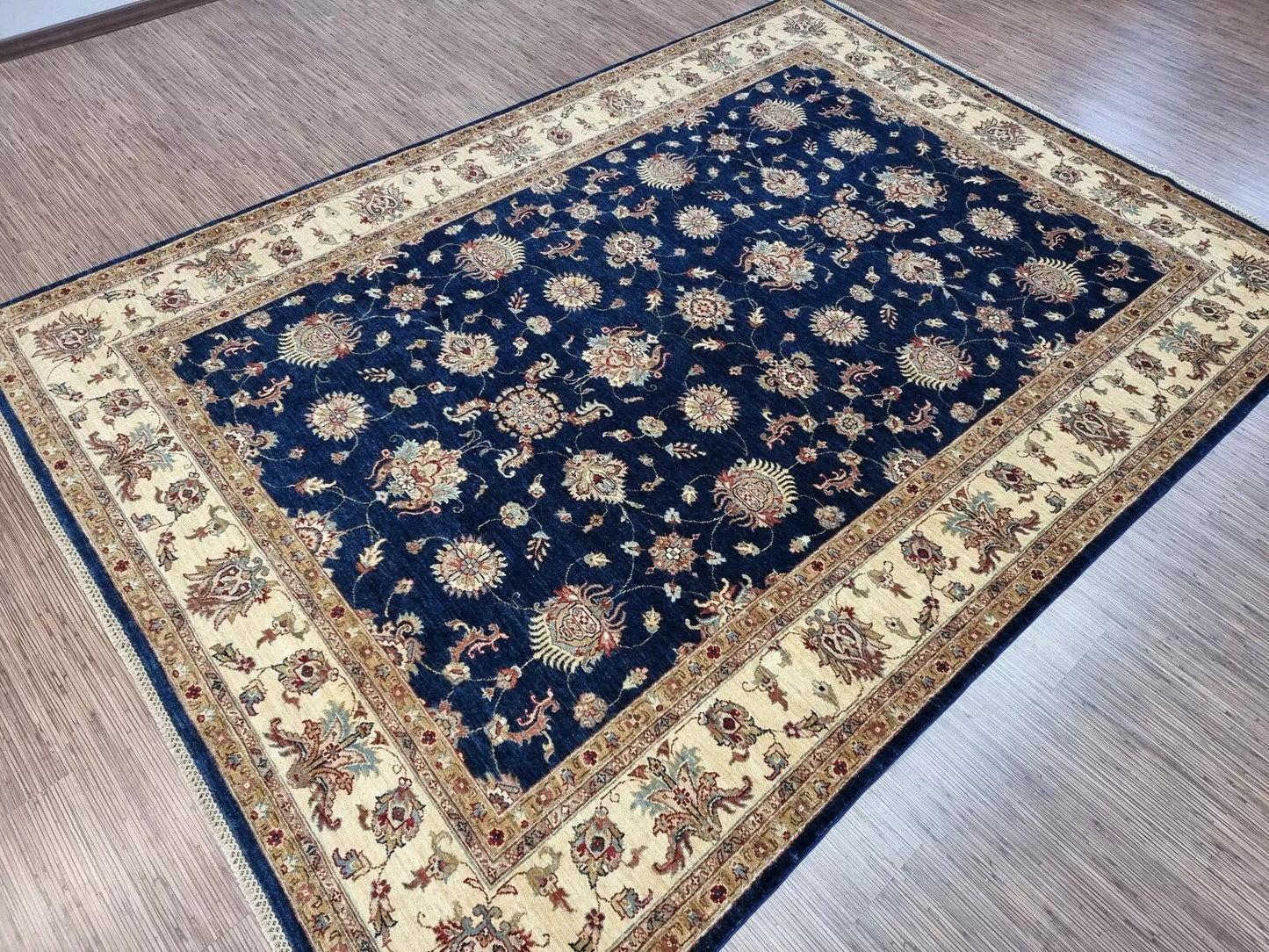 Angle shot capturing the elegant scale and rich color presence of the rug.

