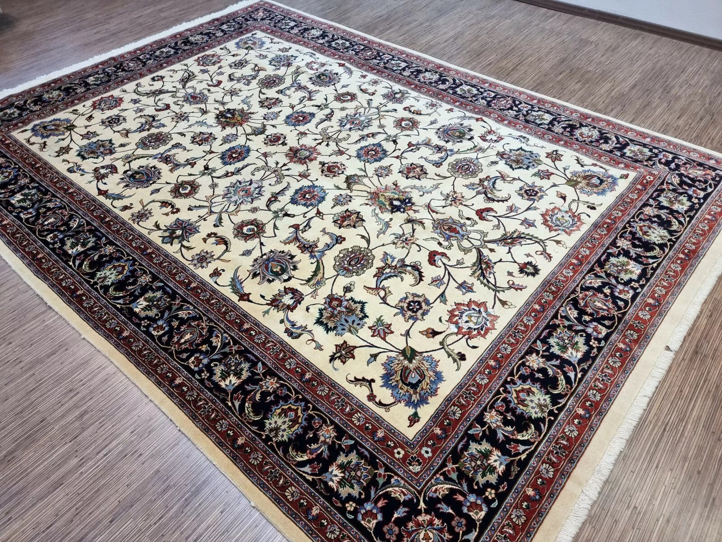 Close-up on the precise hand-knotting and dense pile of the rug.

