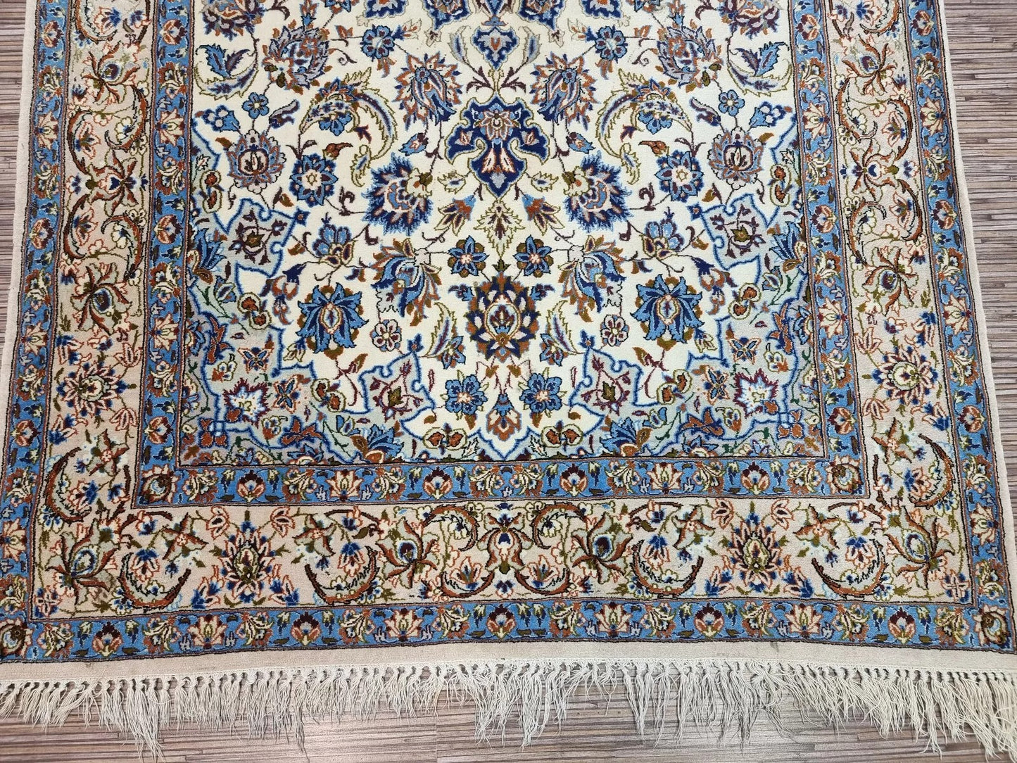 Hand-knotted 1970s Persian Isfahan rug in good vintage condition, featuring an allover intricate floral pattern with exceptional attention to detail.

