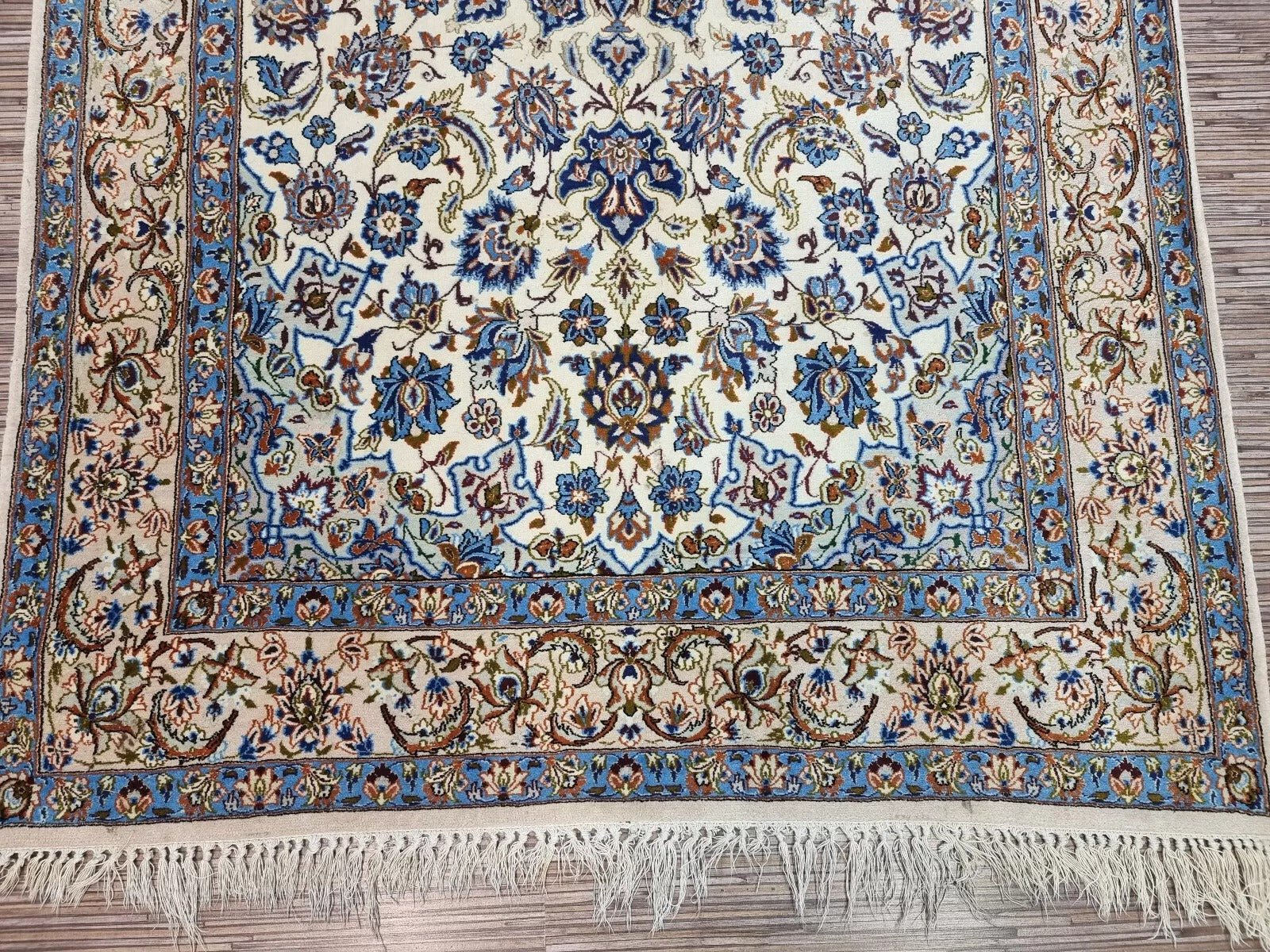 Hand-knotted 1970s Persian Isfahan rug in good vintage condition, featuring an allover intricate floral pattern with exceptional attention to detail.

