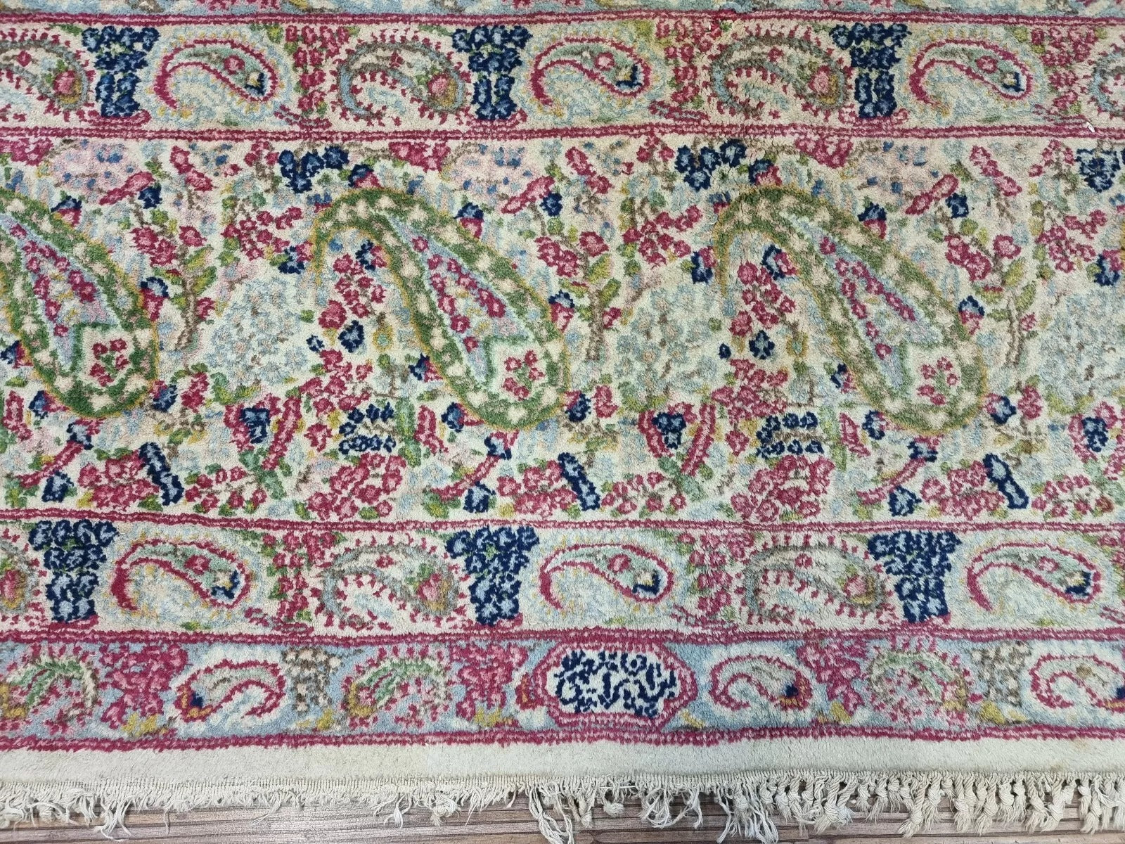 Antique Persian Kerman rug in good condition for its age (circa 90 years old), hand-knotted with premium wool, ideal for collectors seeking authentic Persian weaving.

