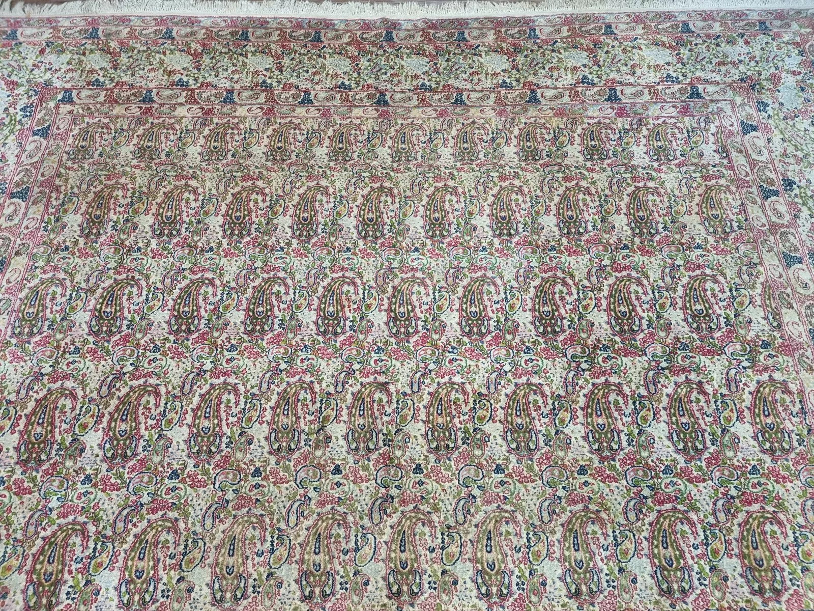 Full perspective of an antique Persian Kerman rug in good vintage condition, requiring professional cleaning for optimal presentation, with classic woven patterns.

