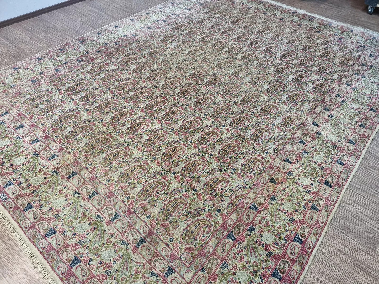 Close-up of the wool pile and hand-knotted weave on a 1930s Persian Kerman rug, highlighting the soft yet resilient texture on a cotton foundation.

