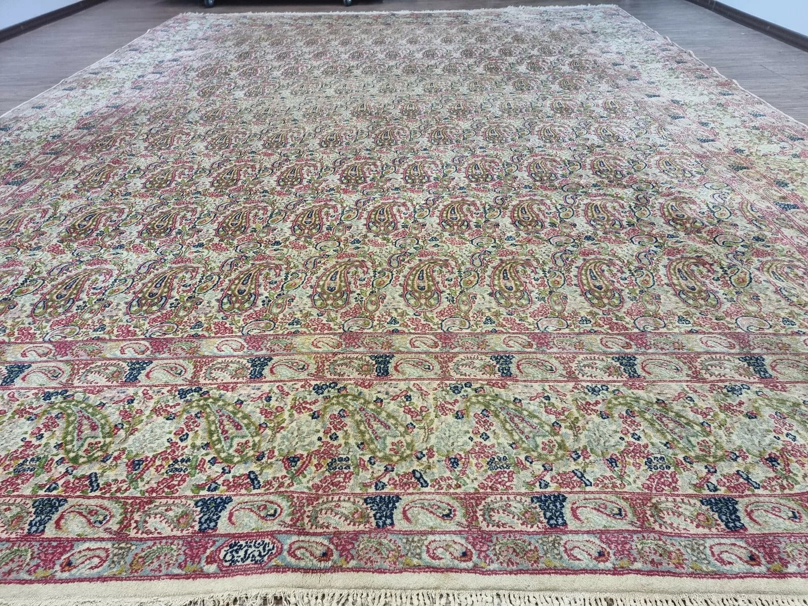 Collector-quality vintage Persian Kerman carpet circa 1930s with traditional allover floral design, neutral beige palette, and room-defining 9.8' x 13' size.

