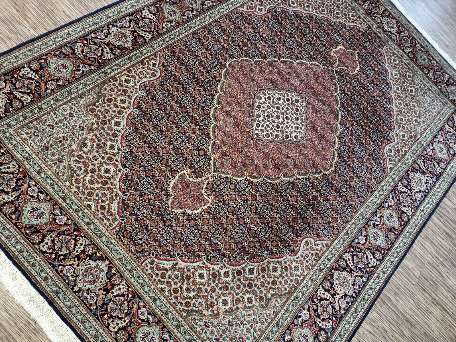 Vintage Persian Tabriz rug measuring 6.7 x 9.2 feet, hand-knotted in the 1970s, professionally cleaned and ready for immediate use in excellent condition.

