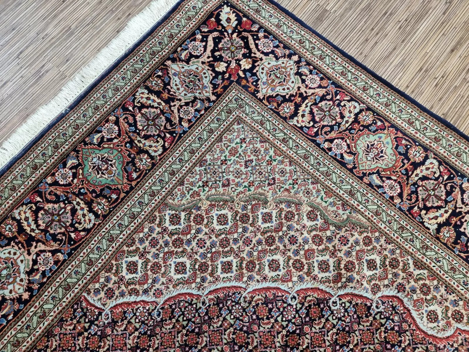 Room-size Persian Tabriz carpet from the 1970s, measuring approximately 203 x 282 cm, with traditional floral patterns in navy, ivory, and blue tones.


