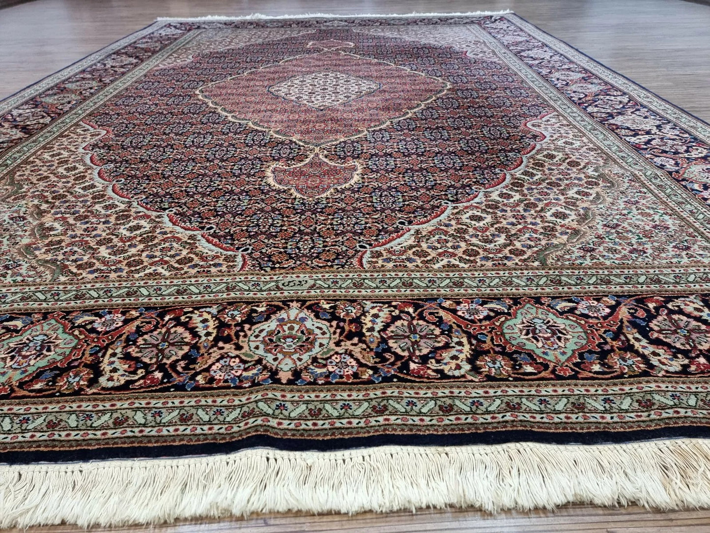 Collector-quality vintage Persian Tabriz carpet circa 1970s with intricate allover floral design, rich blue palette, and exceptional craftsmanship with 500,000 knots per square meter.

