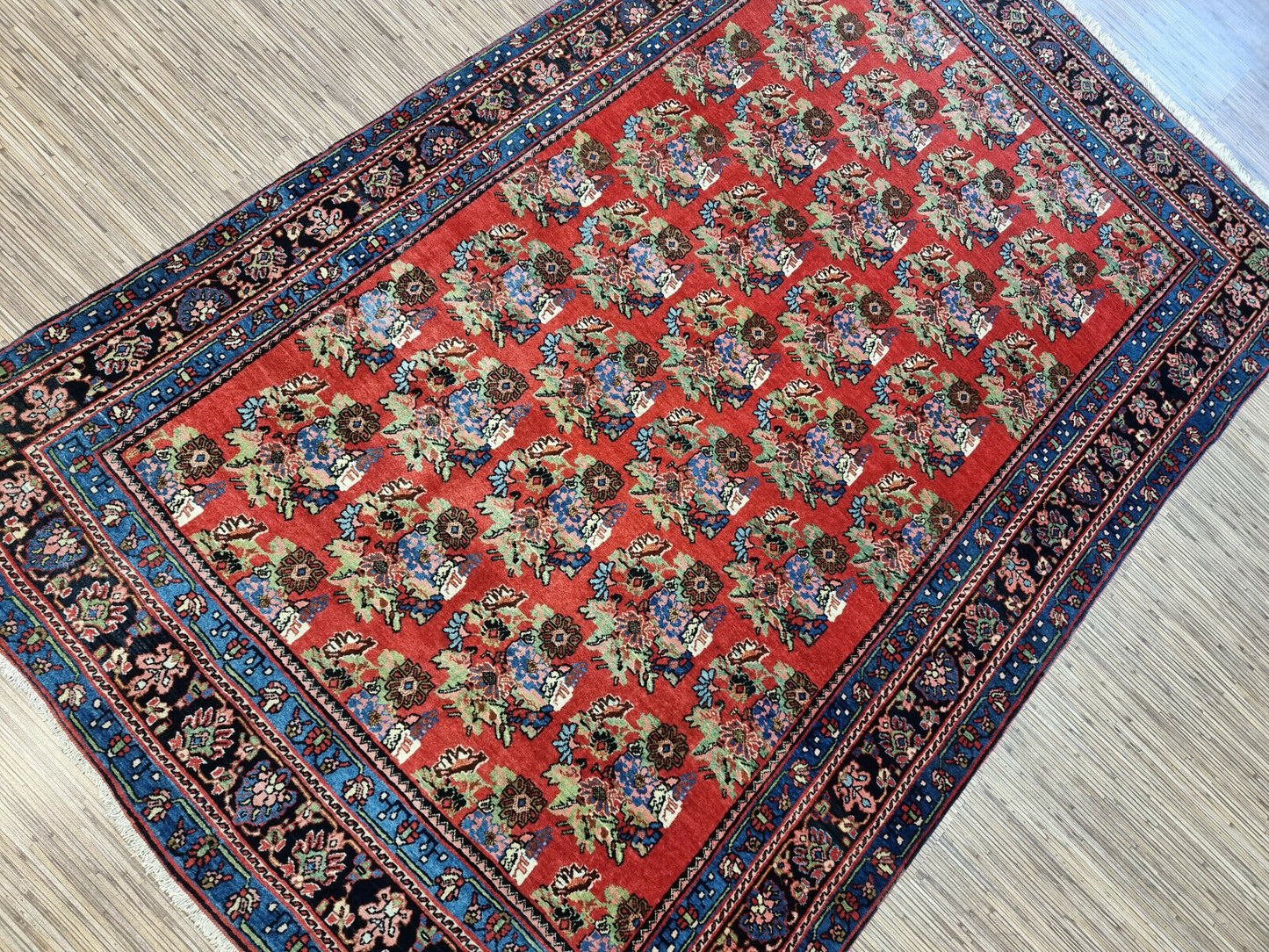 Antique Persian Bidjar rug measuring 4.3 x 6.9 feet, hand-knotted in the early 1900s, professionally cleaned and in excellent condition for its age.


