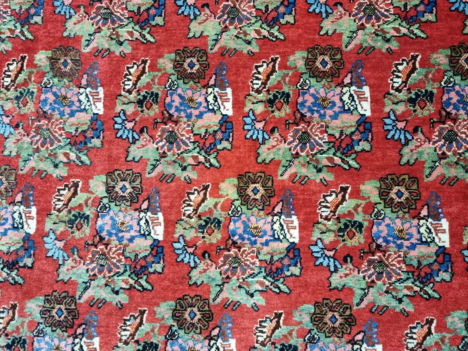 Small antique Persian Bidjar carpet from the 1900s, measuring approximately 132 x 210 cm, with traditional floral design in a warm rust-red color palette.


