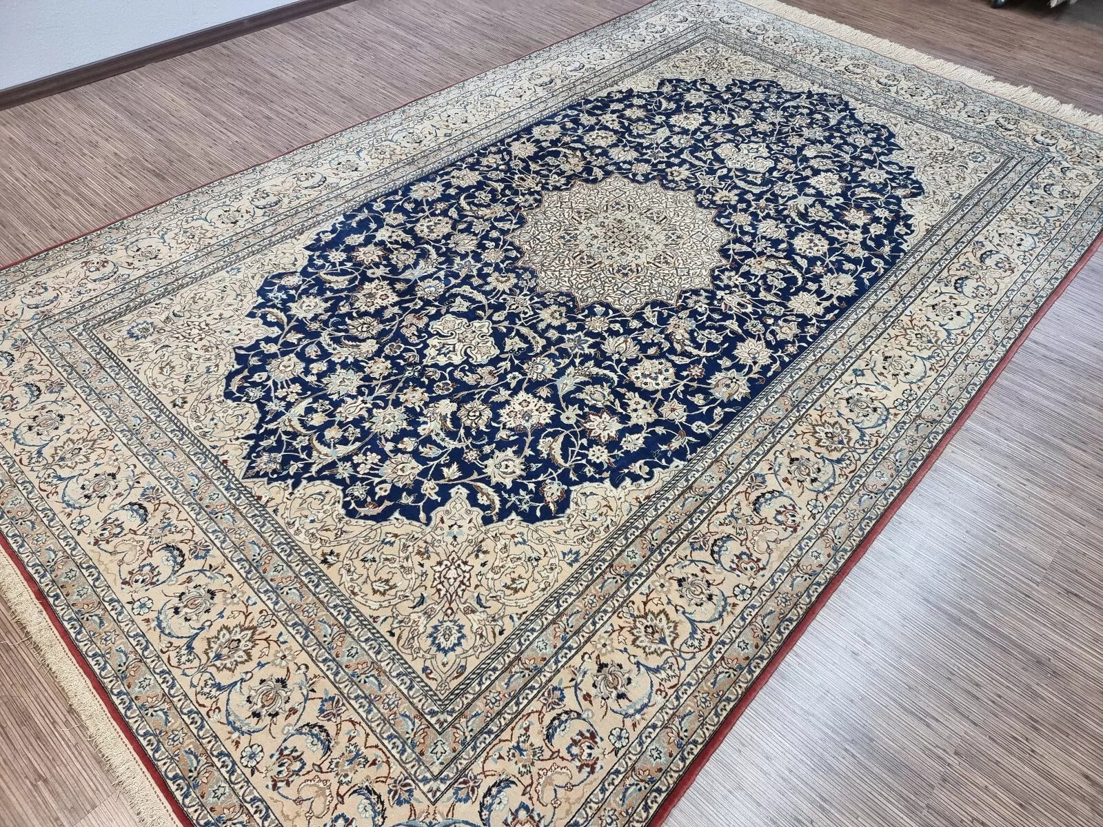 Close-up of the kork wool and silk blend on a 1920s Persian Nain rug, highlighting the added softness and subtle sheen characteristic of high-quality Nain weaving.

