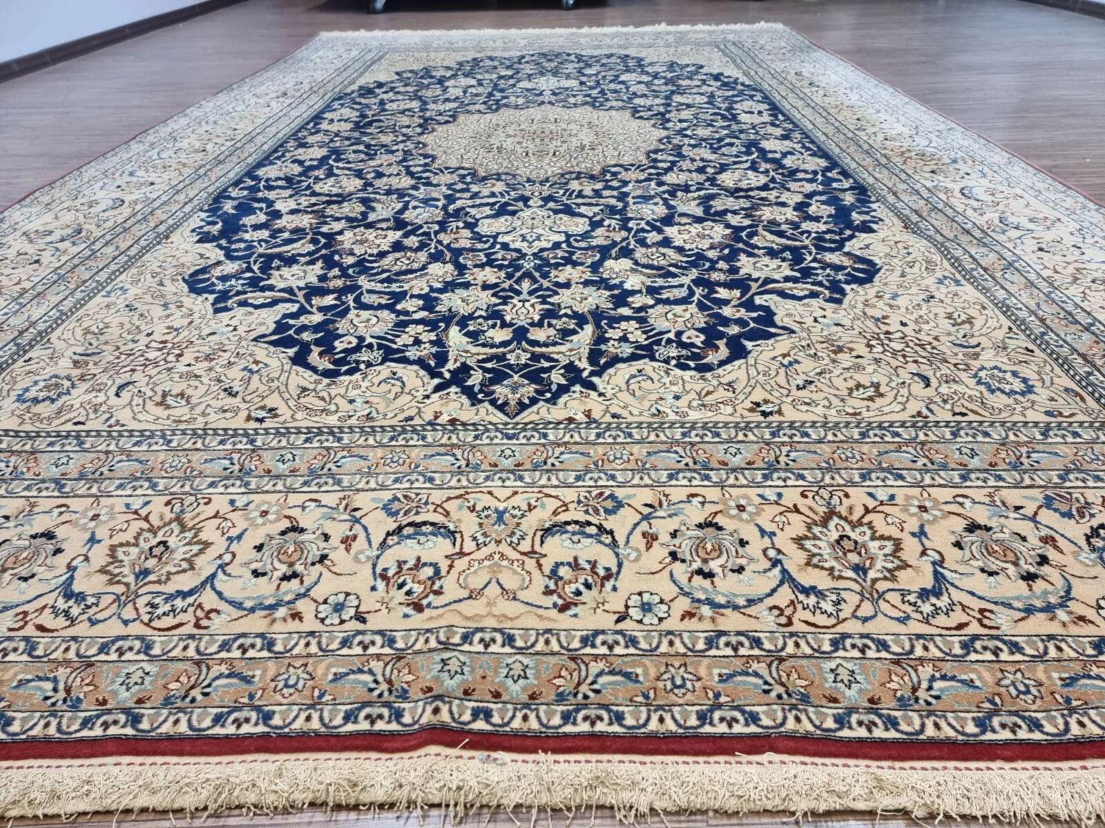Collector-quality antique Persian Nain 6La Tudeshk rug circa 1920s with intricate floral motifs, a central medallion, and an elegant border system in soft ivory, navy, and blue tones.

