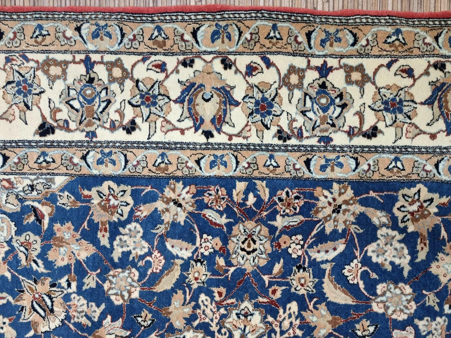 Antique Persian rug from Nain, hand-knotted in the 1920s, featuring kork wool pile on a cotton foundation with approximately 800,000 knots per square meter for exceptional detail and durability.

