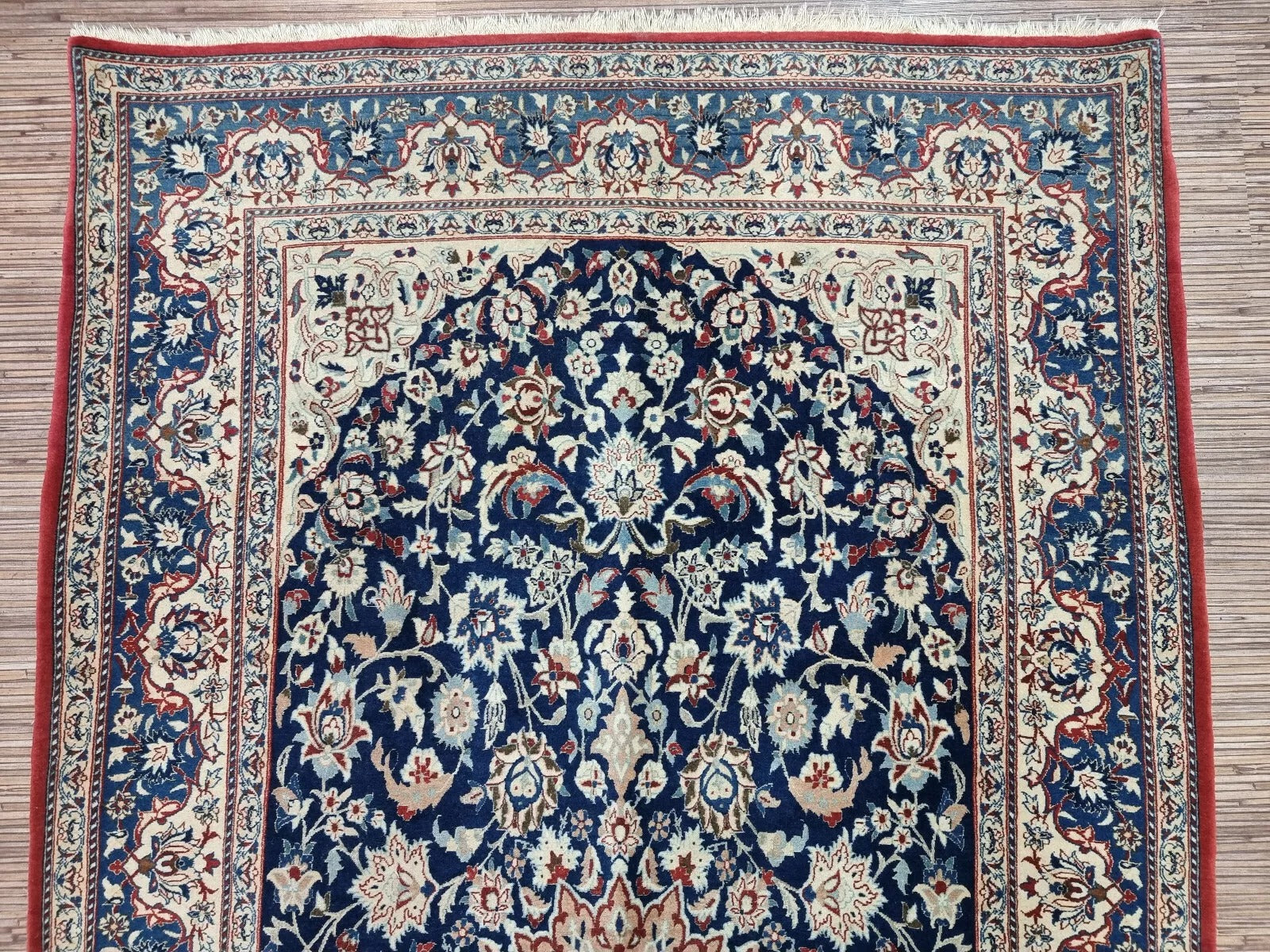 Full perspective of an antique Persian Nain rug displayed in a room, demonstrating its 3.4 × 6.1 foot size as an elegant accent piece for traditional or modern interiors.

