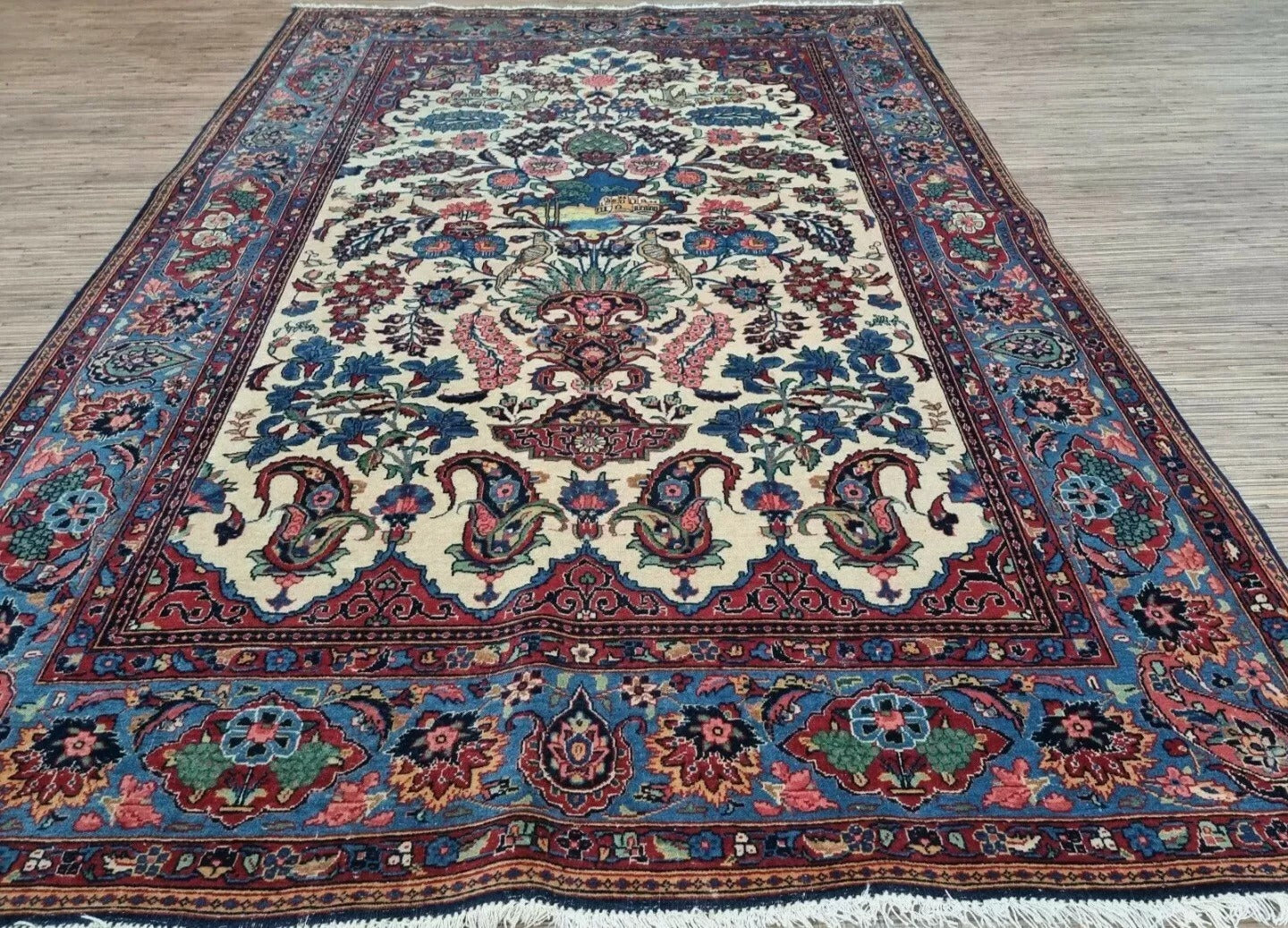 Close-up of the high-knot-density weave on a 1920s Persian Kashan rug, showing the exceptional precision of hand-knotting in premium wool on a cotton foundation.

