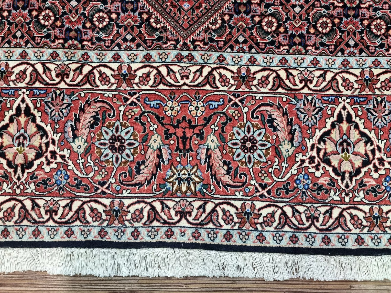 Vintage Persian rug from Bidjar, hand-knotted in the 1970s, featuring premium wool pile on a cotton foundation with traditional Persian patterns and intricate detailing – a masterful blend of design and enduring quality.


