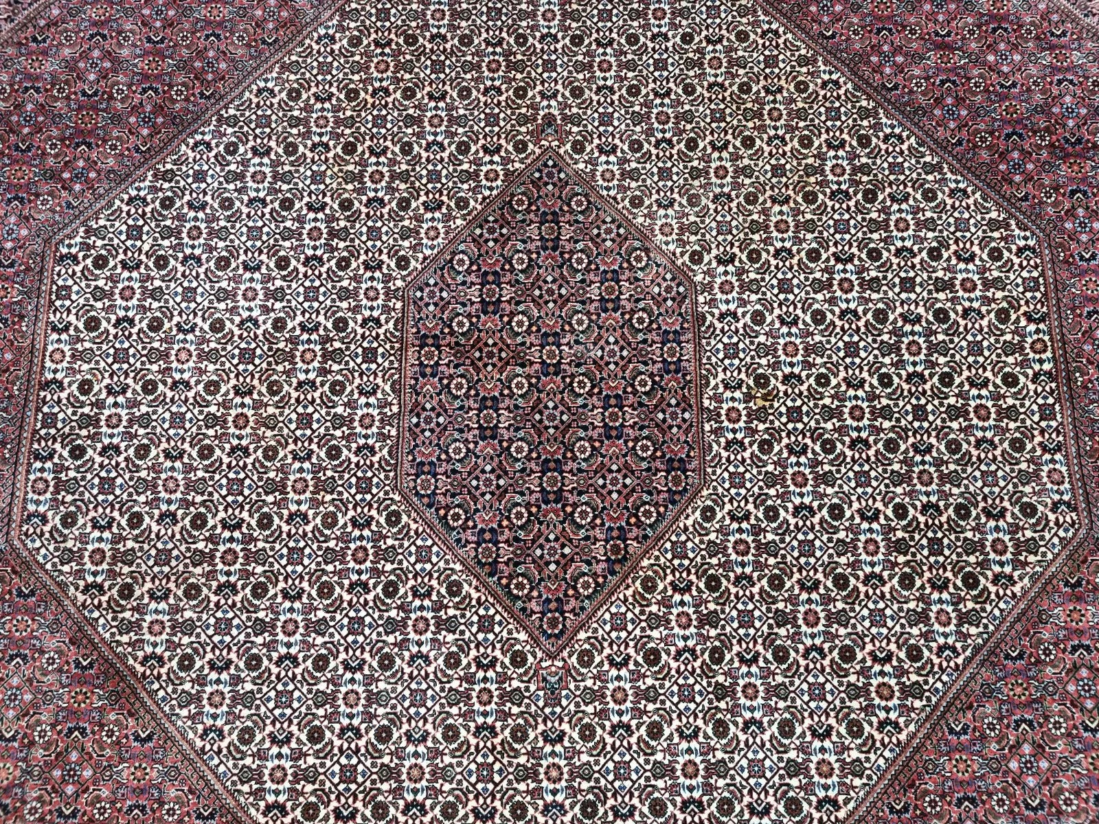 Large vintage Persian Bidjar carpet from the 1970s, measuring approximately 300 × 392 cm, ideal as a centerpiece for expansive living spaces, dining areas, or high-traffic office settings.

