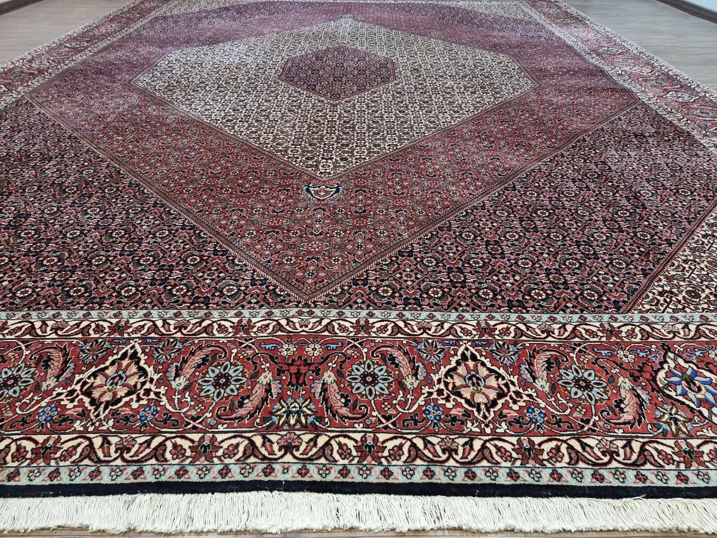 Collector-quality vintage Persian Bidjar rug circa 1970s with a rich red field, ornate central medallion, richly detailed corner spandrels, and a harmoniously patterned border system in complementary tones.

