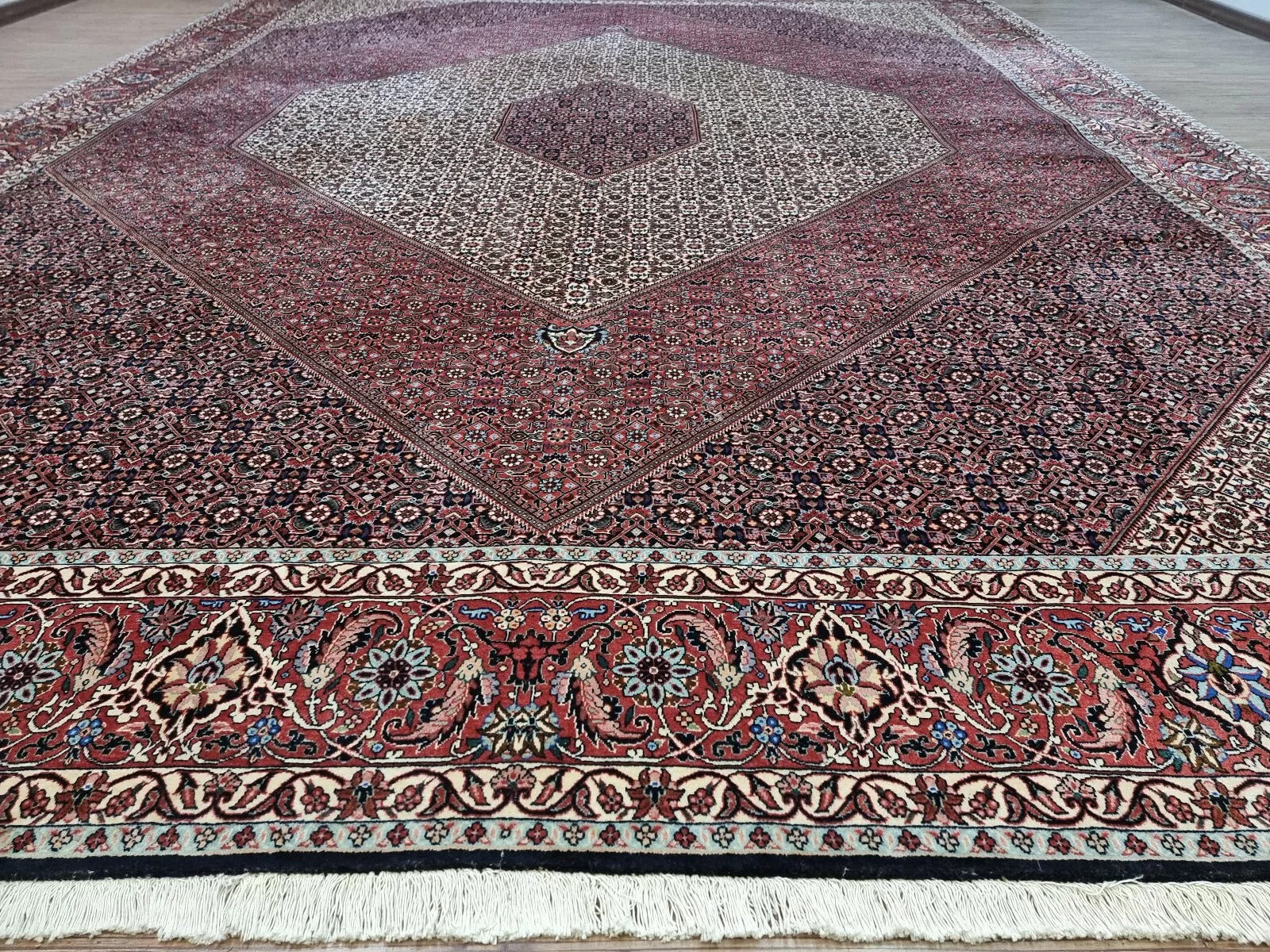 Collector-quality vintage Persian Bidjar rug circa 1970s with a rich red field, ornate central medallion, richly detailed corner spandrels, and a harmoniously patterned border system in complementary tones.

