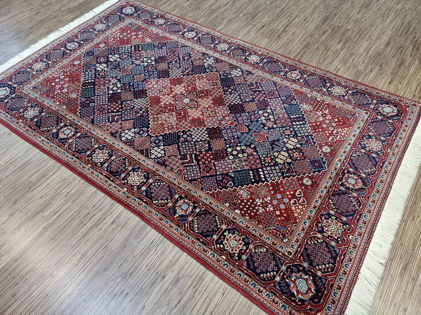 Vintage Persian rug from Kashan, hand-knotted in the 1950s, featuring pure wool pile on a cotton foundation with timeless geometric patterns and classic Kashan motifs in vibrant blue shades.

