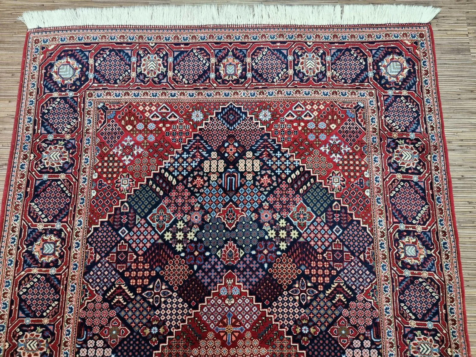 Collector-quality vintage Persian Kashan rug circa 1950s with a vibrant blue field, ornate geometric medallion, richly detailed corner spandrels, and a harmoniously patterned border system.


