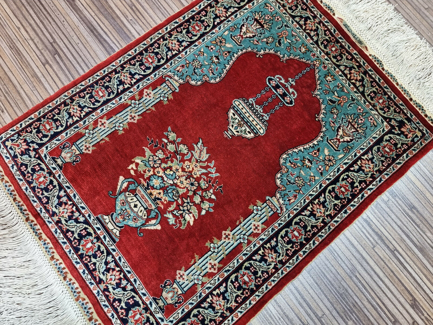 Vintage Turkish Hereke silk rug measuring 13 × 17 inches, hand-knotted circa 1970s in excellent vintage condition with minimal signs of use, previously used as a wall tapestry.

