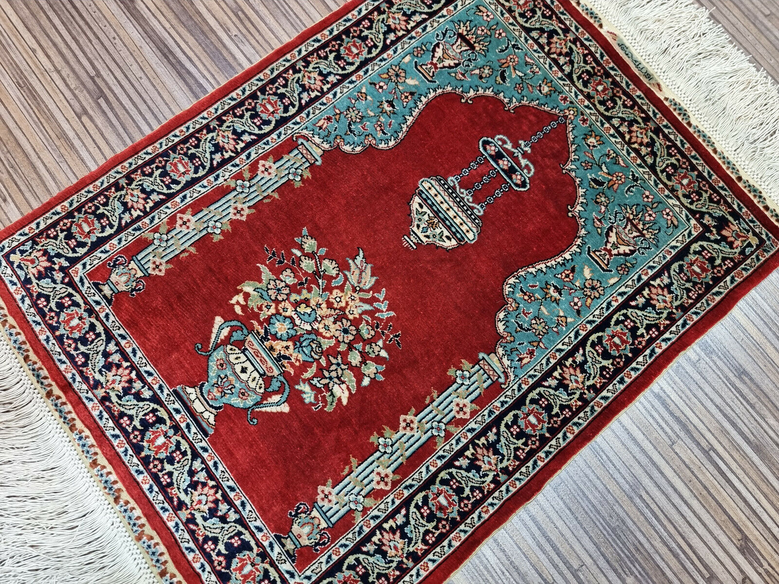 Vintage Turkish Hereke silk rug measuring 13 × 17 inches, hand-knotted circa 1970s in excellent vintage condition with minimal signs of use, previously used as a wall tapestry.

