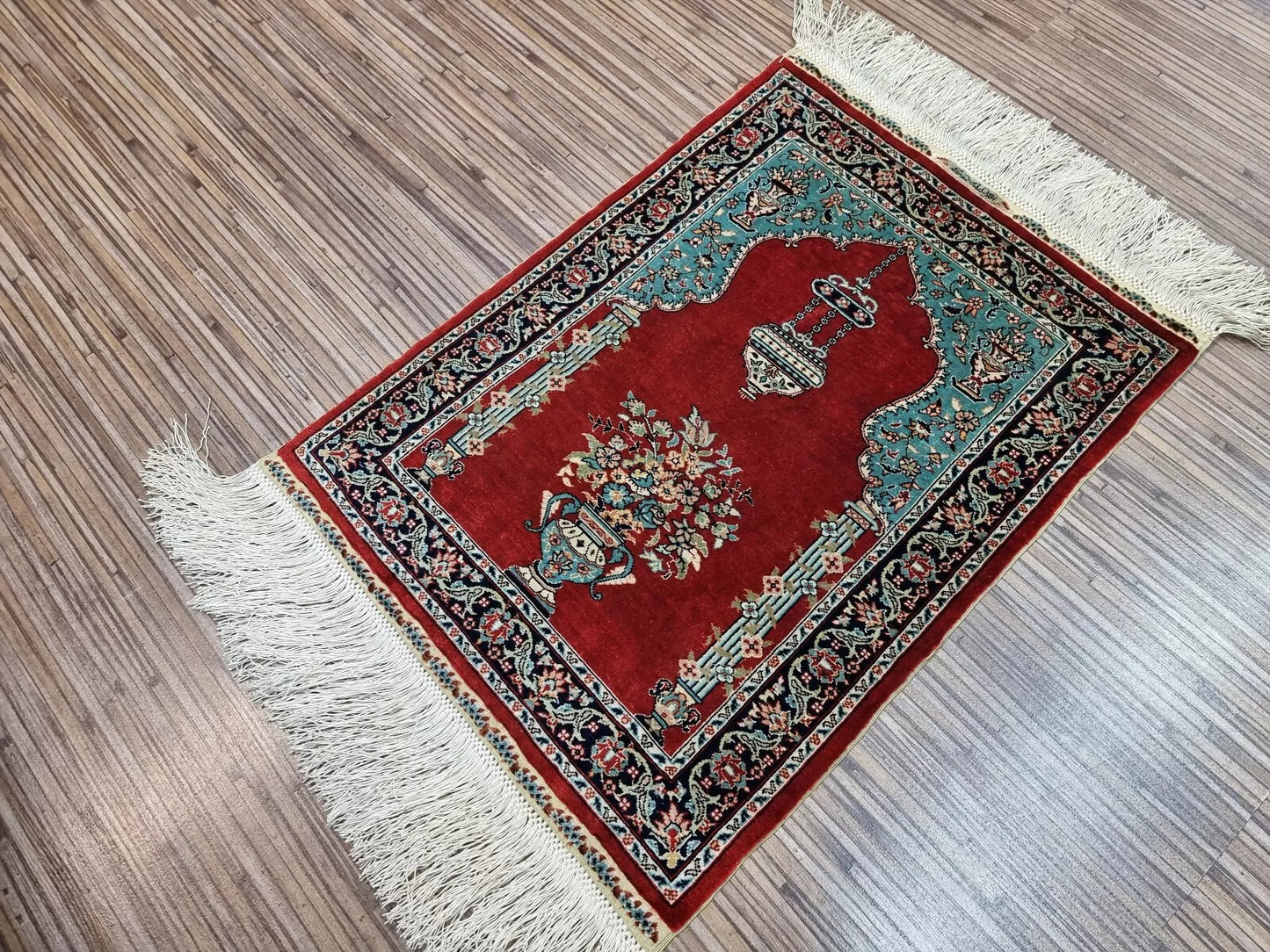 Small-format antique-style Turkish Hereke silk rug from the 1970s, measuring approximately 33 × 45 cm, ideal for use as a wall hanging, table centerpiece, or display collection piece.

