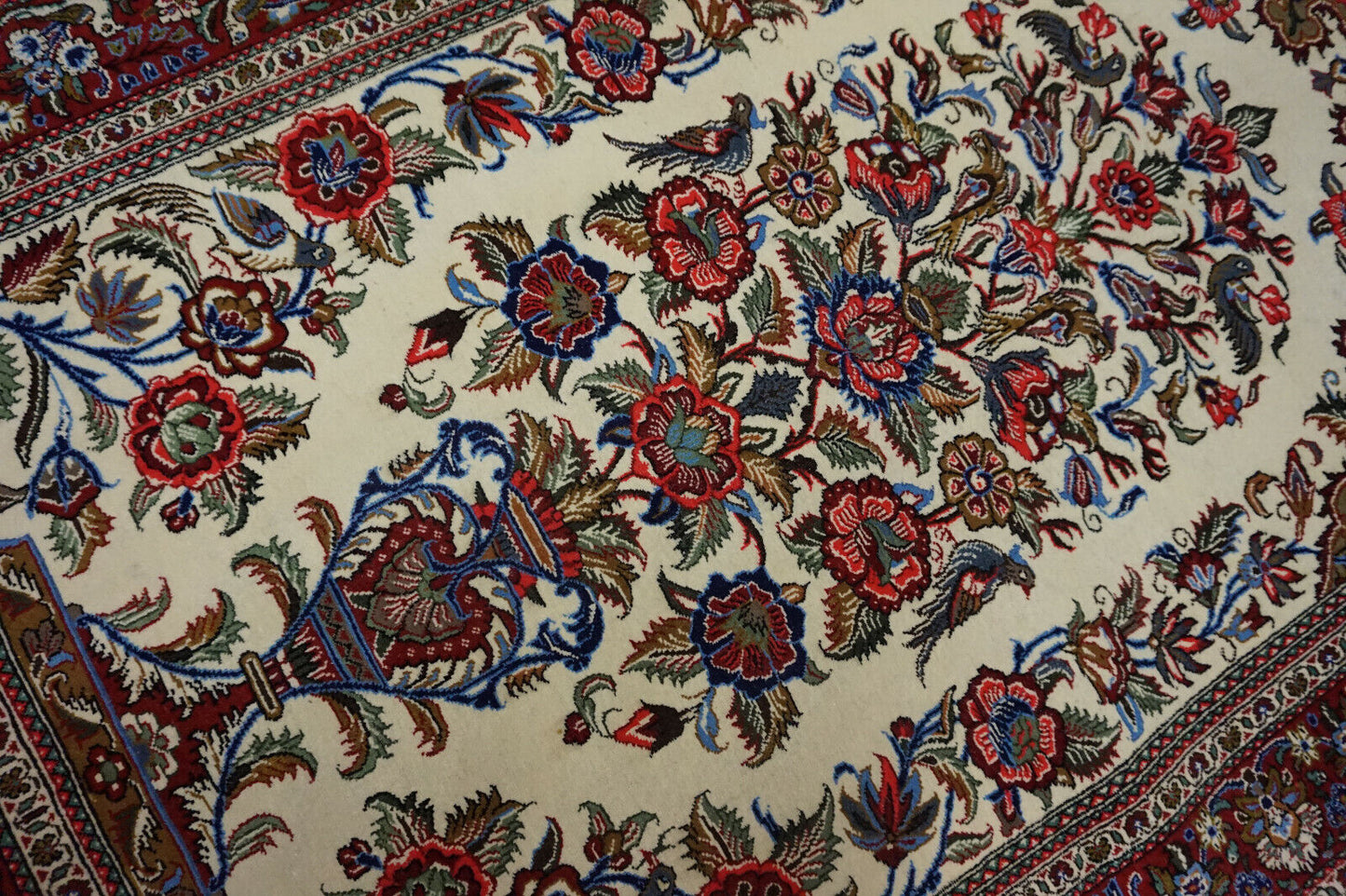 Green floral patterns enhancing the elegance of the Persian Rug